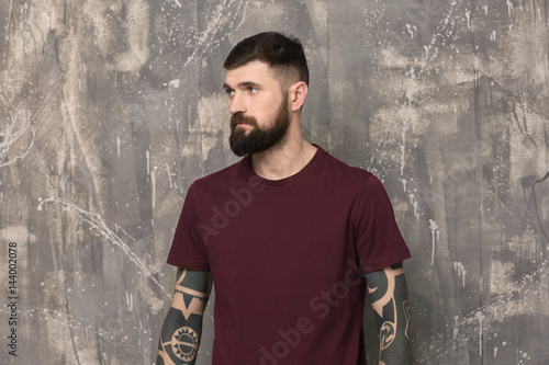 Handsome tattooed young man...