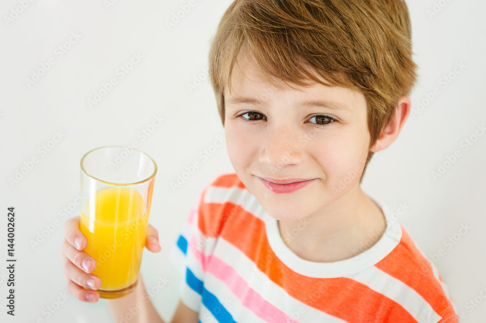 Boy having a glass of refreshing fruit juice Boy having a glass of refreshing fruit juice