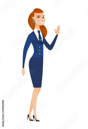 Young caucasian stewardess waving her hand.