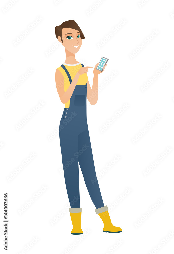 Caucasian farmer holding a mobile phone. Caucasian farmer holding a mobile phone.
