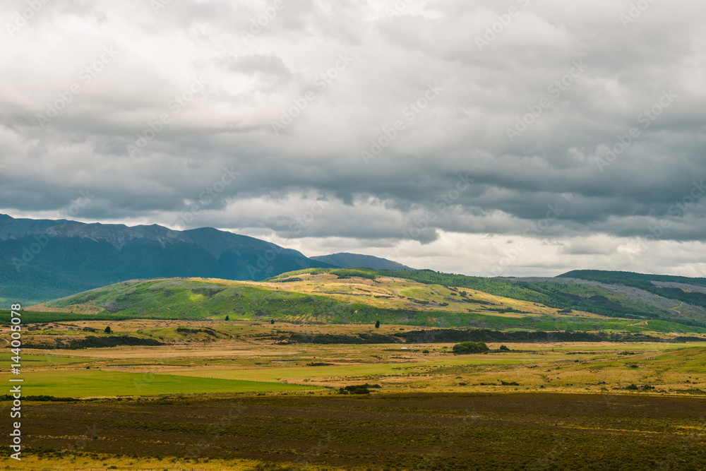 Fototapeta premium view of mountains at sunset, Queenstown, New Zealand.