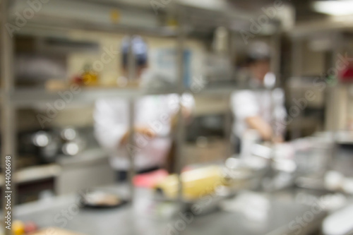 blurred chef Cooking  in restaurant kitchen