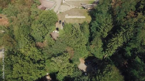 Drone flight over wood and gun shooting range at lonely stone pit
 photo