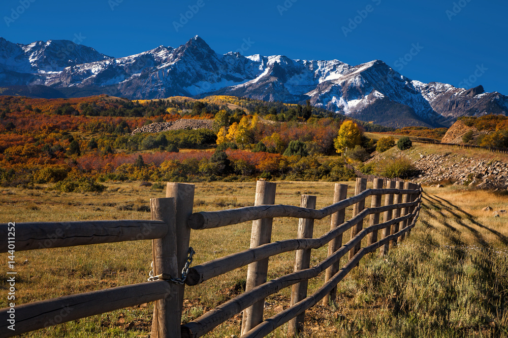 Field and mountains at autumn