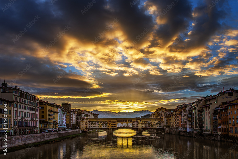Storm clouds clearing at sunrise over the Ponte Vecchio