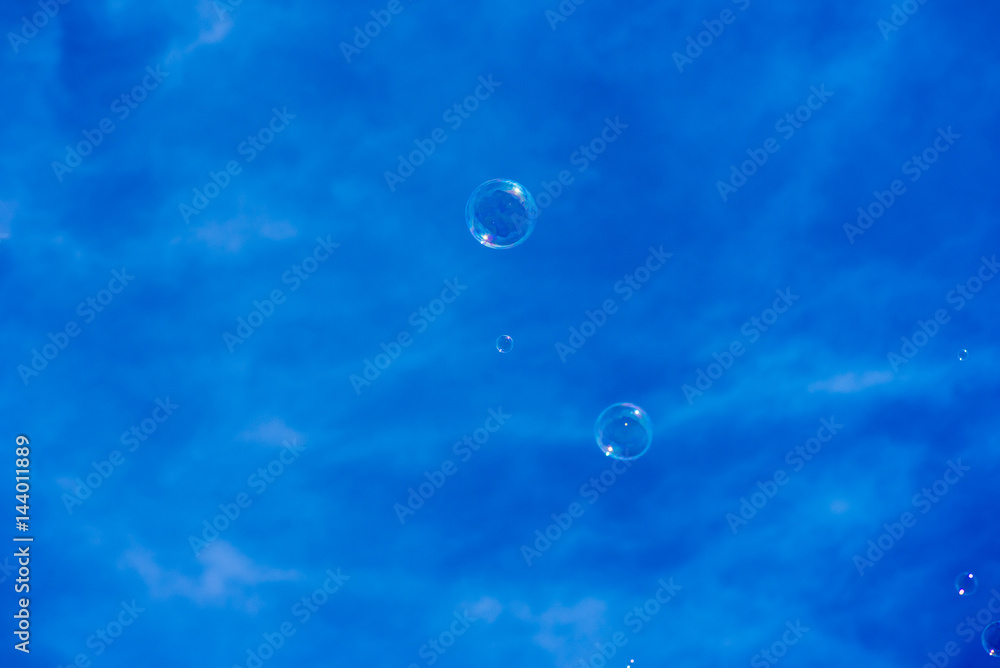 blowing bubbles into blue sky blowing bubbles into blue sky
