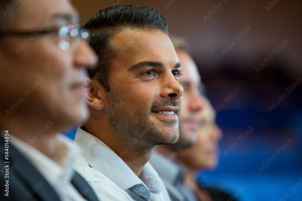 Fotografie Business executives listening to speech