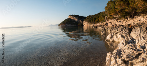 Panorama of calm Adriatic sea and rocky coastline