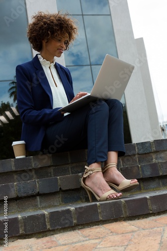 Businesswoman using laptop