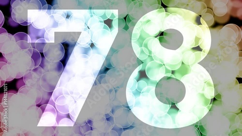Seventy eight to seventy nine years birthday fade in/out animation with color gradient moving bokeh background. Animation: 90 frames still with number, 180 fade out, 30 clear, 180 fade in, 300 still. photo