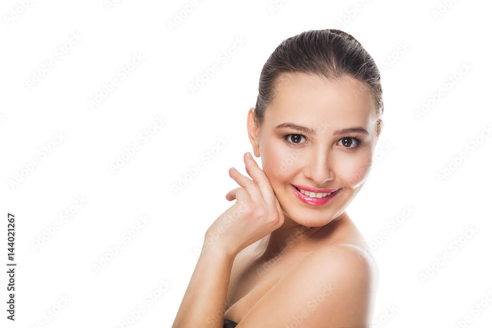 beautiful brunette girl with delicate make-up on whitebackground looks with a smile at the camera Spa care open bare shoulders cosmetics skin beautiful brunette girl with delicate make-up on whitebackground looks with a smile at the camera Spa care open bare shoulders cosmetics skin
