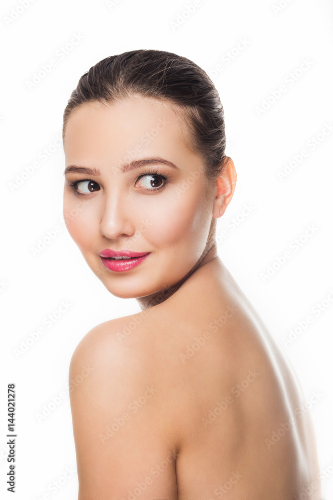 beautiful brunette girl with delicate make-up on white background looking with a smile towards Spa care open bare shoulders cosmetics skin beautiful brunette girl with delicate make-up on white background looking with a smile towards Spa care open bare shoulders cosmetics skin