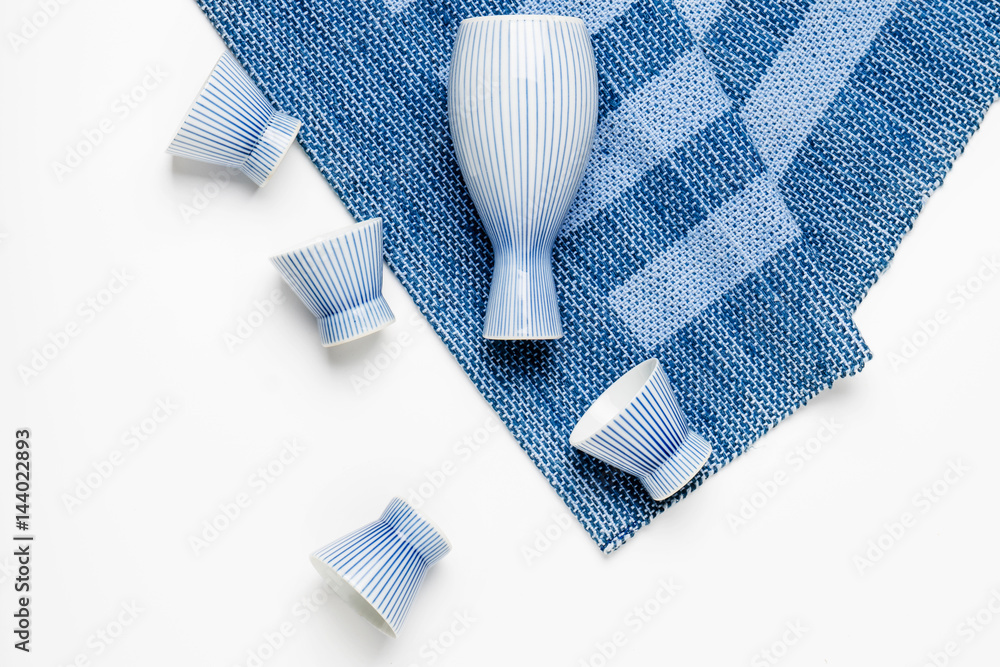 Sake bottle and cup on white background Sake bottle and cup on white background