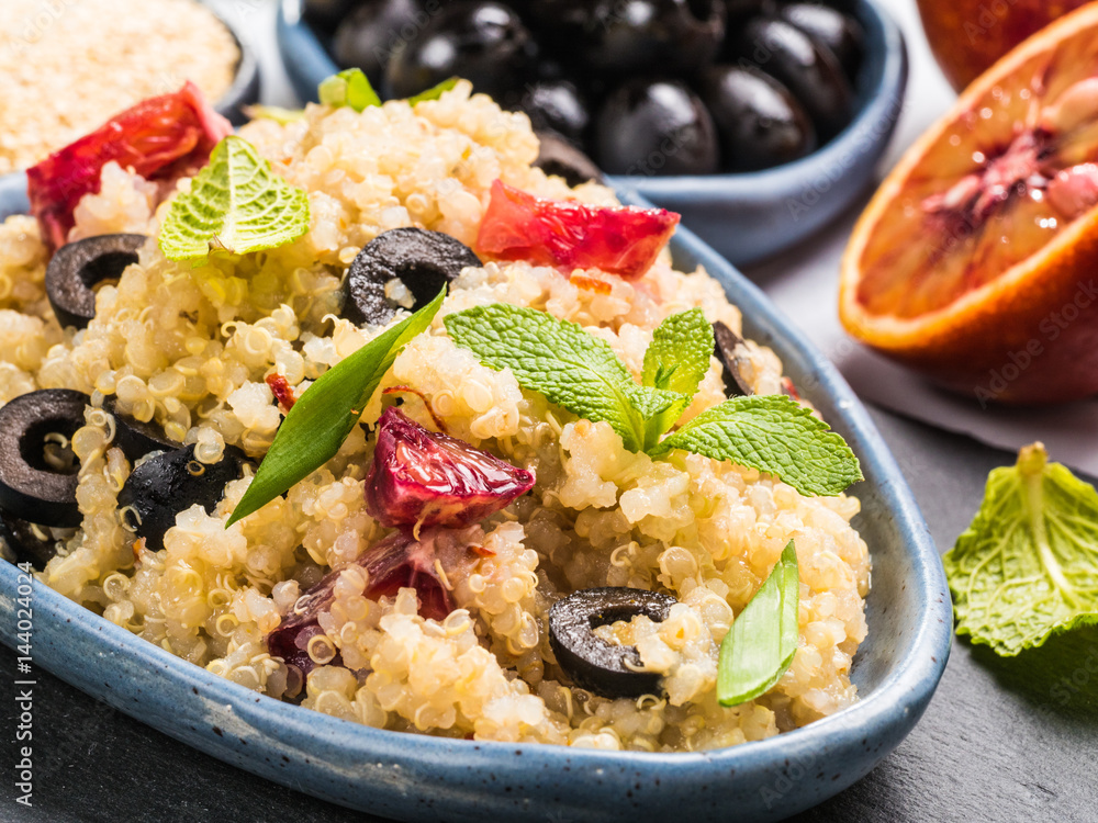 Vegan salad with quinoa, red orange and black olives Vegan salad with quinoa, red orange and black olives