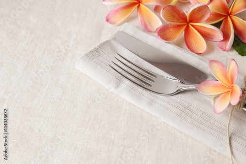 Hawaii Frangipani  Plumeria   Flower Table setting copy space background  selective focus toning