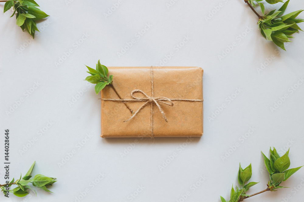 Cute gift box wrapped with craft paper top view Cute gift box wrapped with craft paper top view