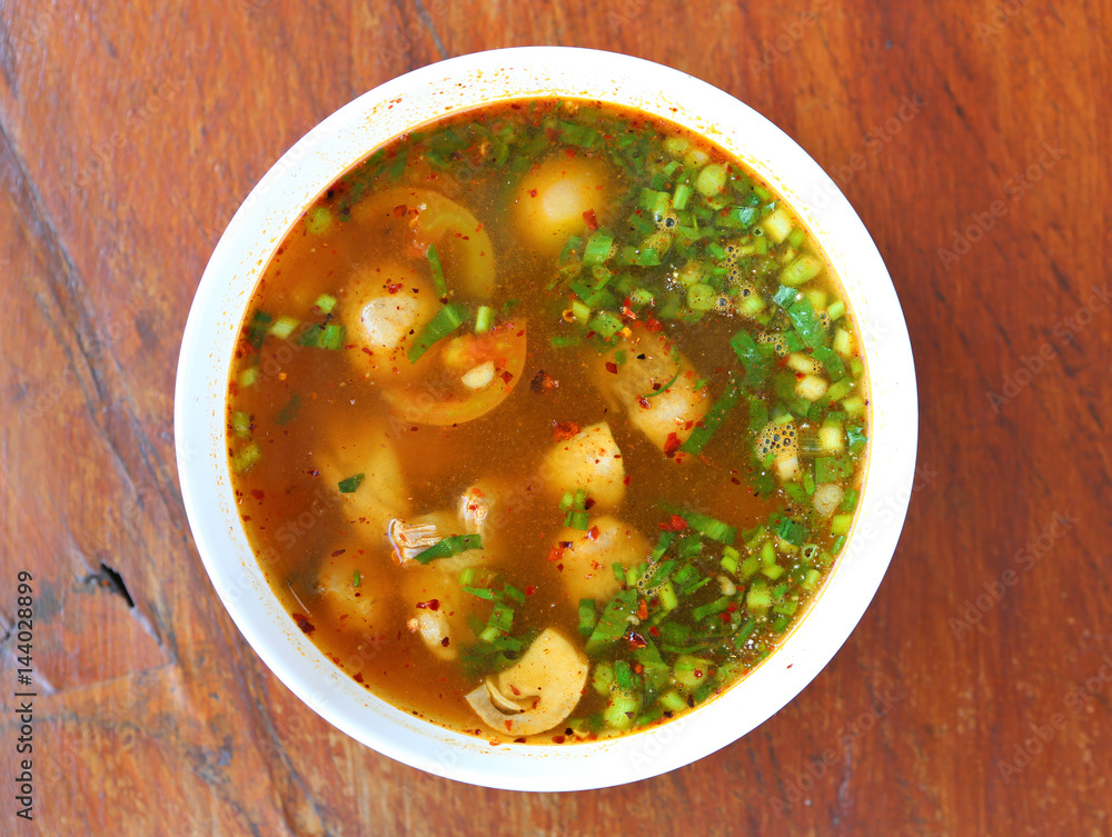 Hot and spicy soup with pork ribs, shallow Depth of Field, Focus on pork ribs