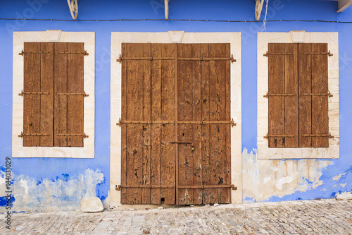 Old wooden door with metal hinges and lock photo