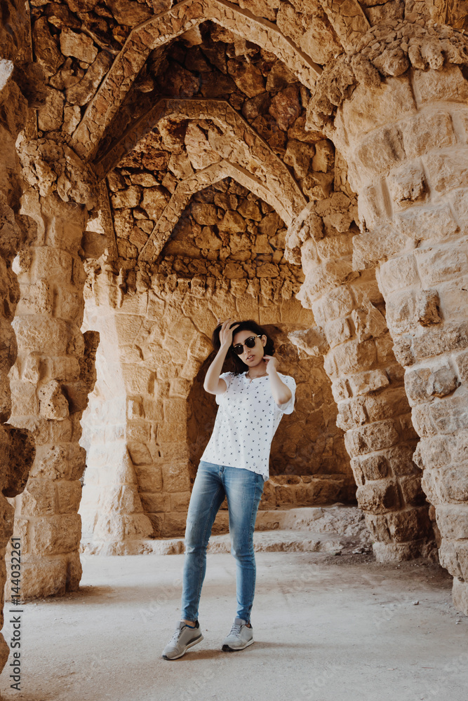 Young woman posing in Park Guell in Barcelona