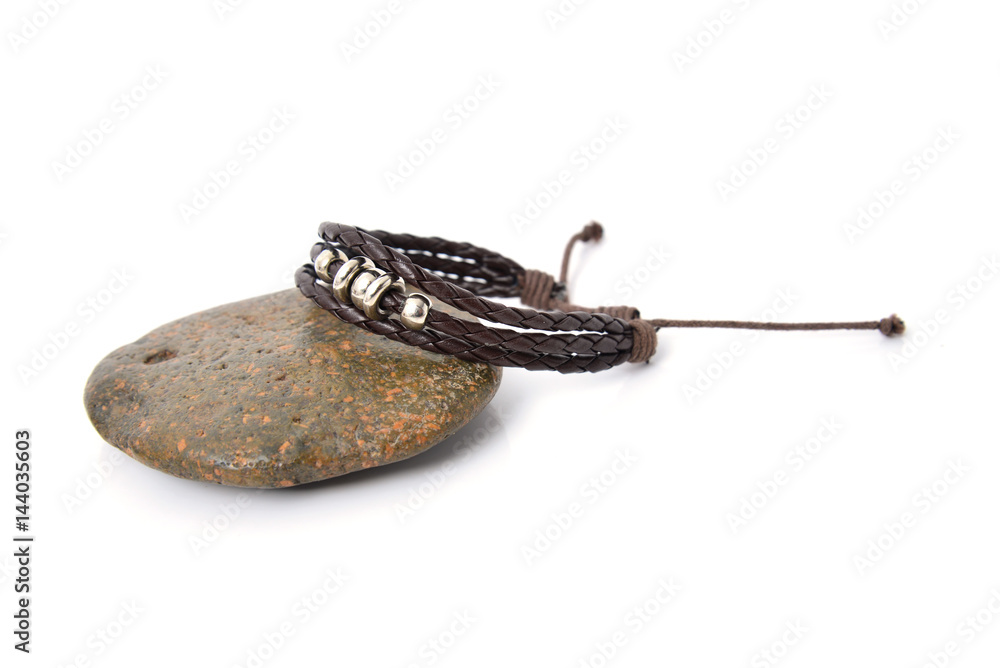 closeup men's leather bracelet on white background closeup men's leather bracelet on white background