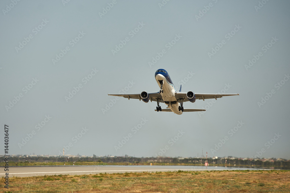 Private passenger plane taking over airport runway. Use for air transport and traveling theme. Private passenger plane taking over airport runway. Use for air transport and traveling theme.