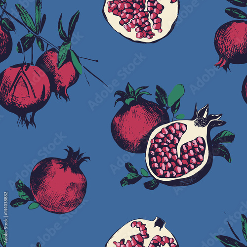 Seamless pattern with pomegranates. Fruits on blue background.