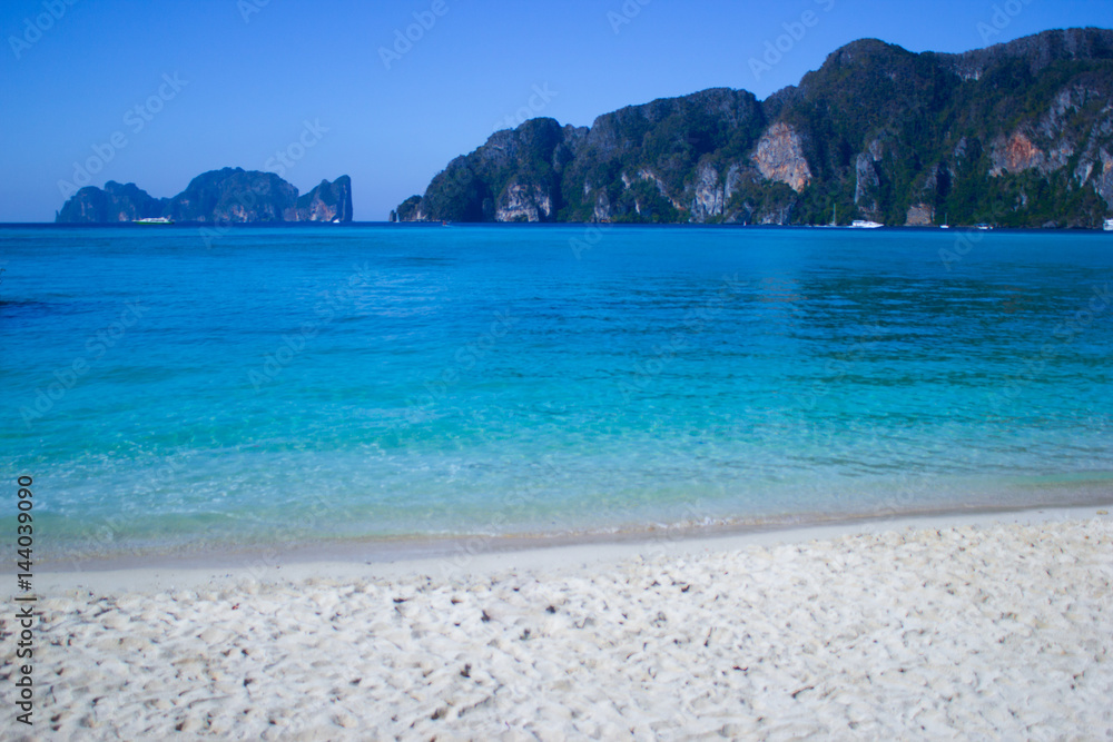 Beach with white sand and blue water