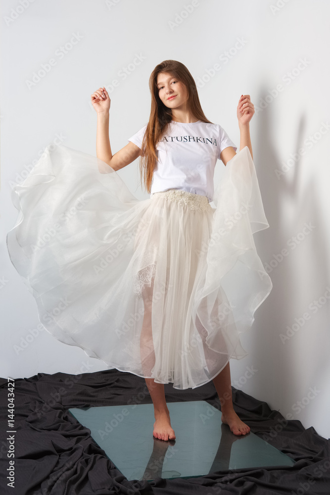 Fashion model in transparent skirt and shirt. Flying dress. Stock-Foto |  Adobe Stock