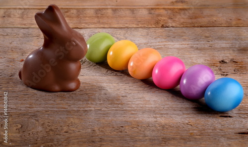 Chocolate Rabbit and colorful easter eggs
