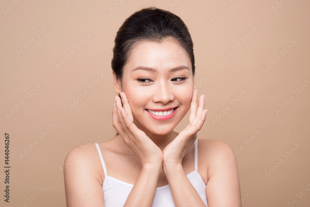 Beauty face. Facial treatment. Young asian woman with clean perfect skin touch her face. Beauty face. Facial treatment. Young asian woman with clean perfect skin touch her face.