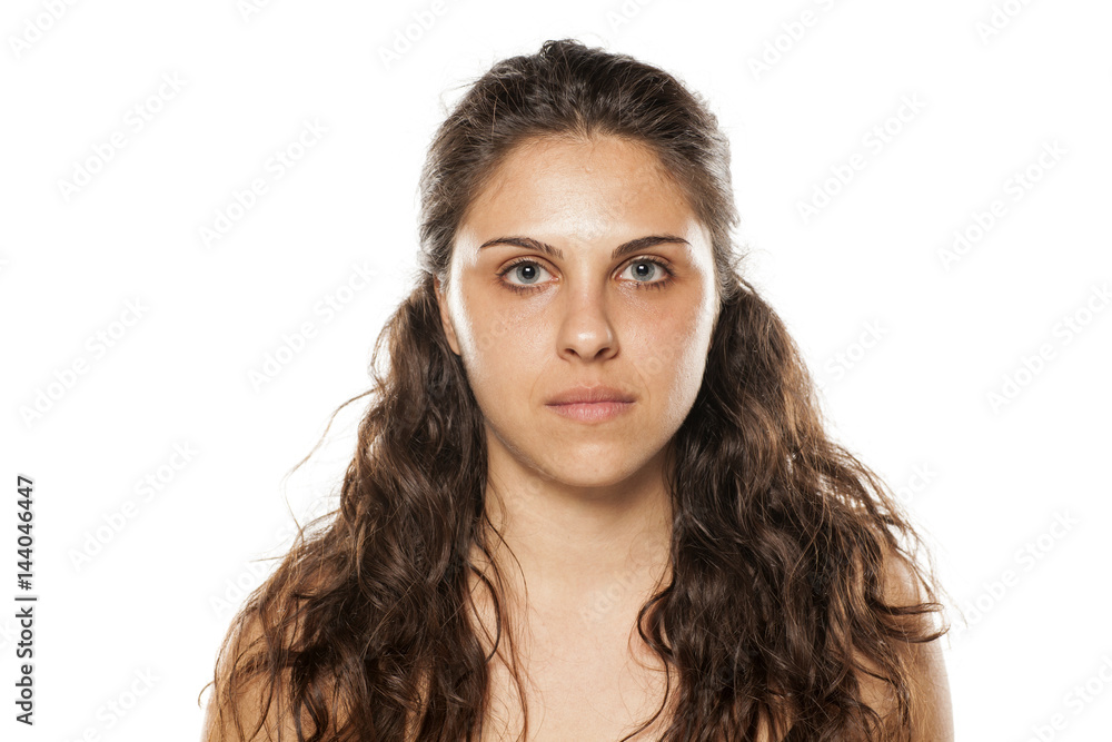 beautiful young woman with curly hair and blue eyes posing without makeup beautiful young woman with curly hair and blue eyes posing without makeup