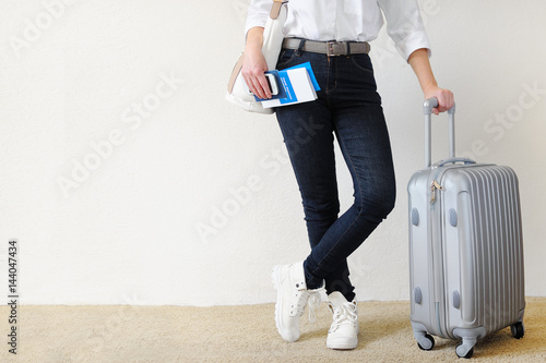 Woman with the suitcase goes on a journey. Travel insurance.