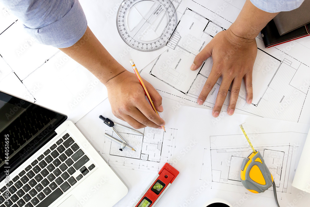 © iamaea - Interior designer discussing data and digital tablet and computer laptop with business document and graphics design diagram on wooden desk as concept © iamaea - Interior designer discussing data and digital tablet and computer laptop with business document and graphics design diagram on wooden desk as concept