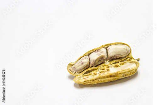 Peanuts boiled and peeled on a white background.