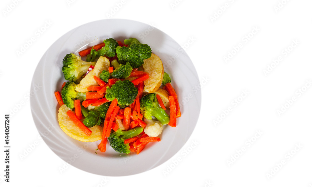 Mixed vegetables on a plate. top view. isolated on white Mixed vegetables on a plate. top view. isolated on white