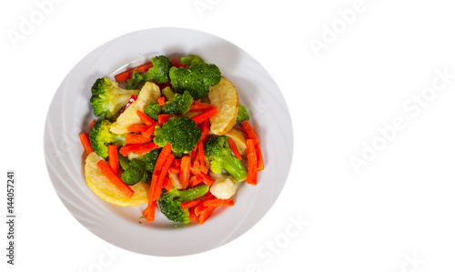 Mixed vegetables on a plate. top view. isolated on white