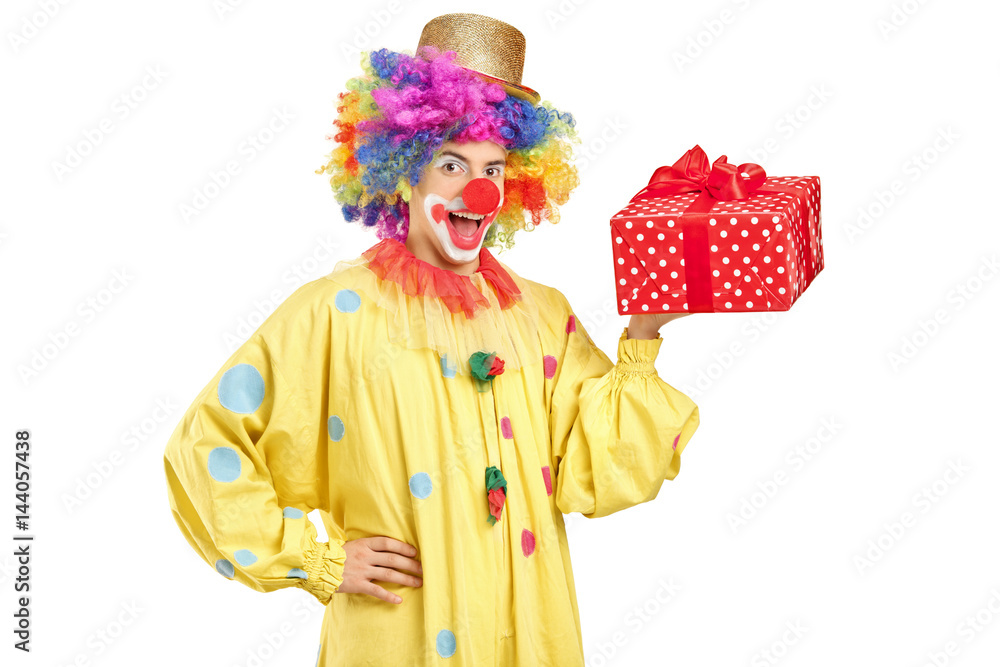 Joyful clown with a present