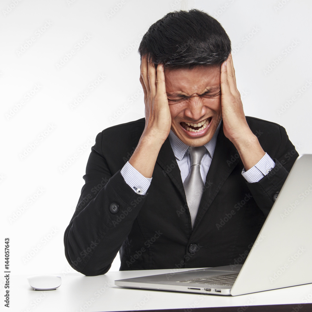 Businessman stressed at work on white background Businessman stressed at work on white background