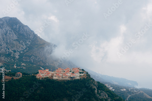Russian village in Montenegro. Settlement for the rich on the mountain. Houses with red tiles. © Nadtochiy