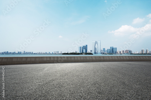 empty road with cityscape of modern city