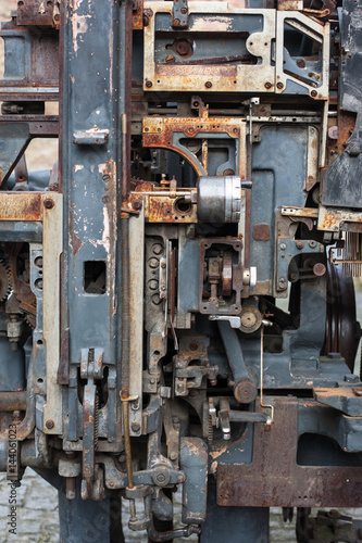 Old rusty printing machine complex mechanism of metal