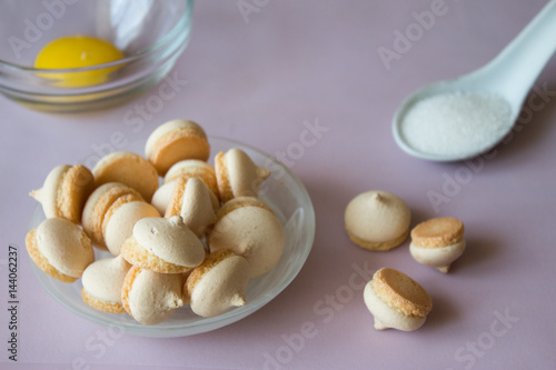 Close up of cookies with sugar and egg. Pink background