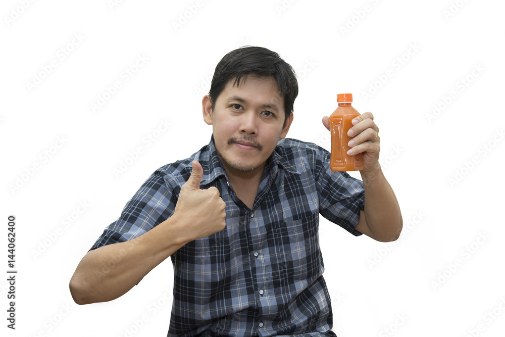 Asian Man holding a glass of carrot juice over white background Asian Man holding a glass of carrot juice over white background