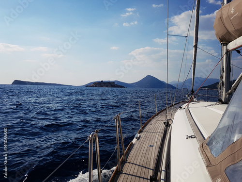 Yacht sails on the blue sea © Dixi_