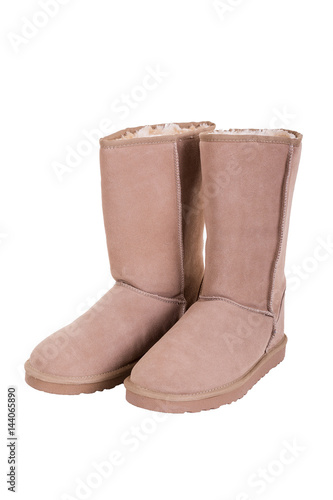 Fashion winter ugg boots of sheepskin isolated on white backgrou © bearmoney