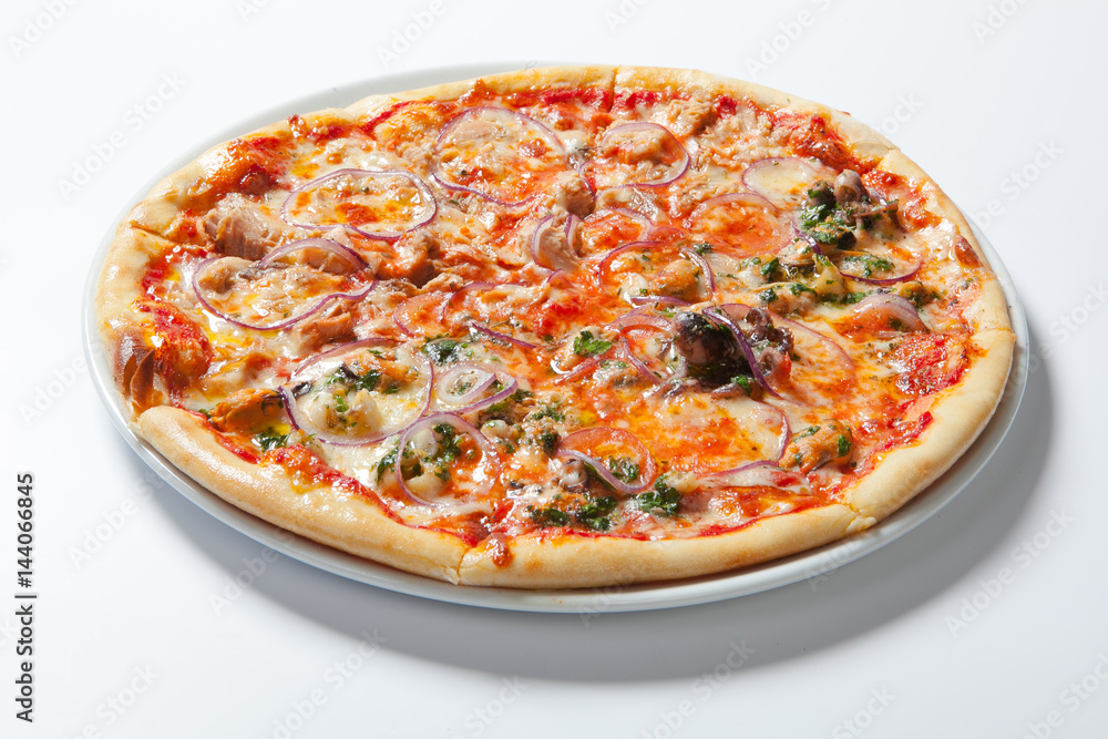 Pizza with onion, ham, cheese and tomato. White background