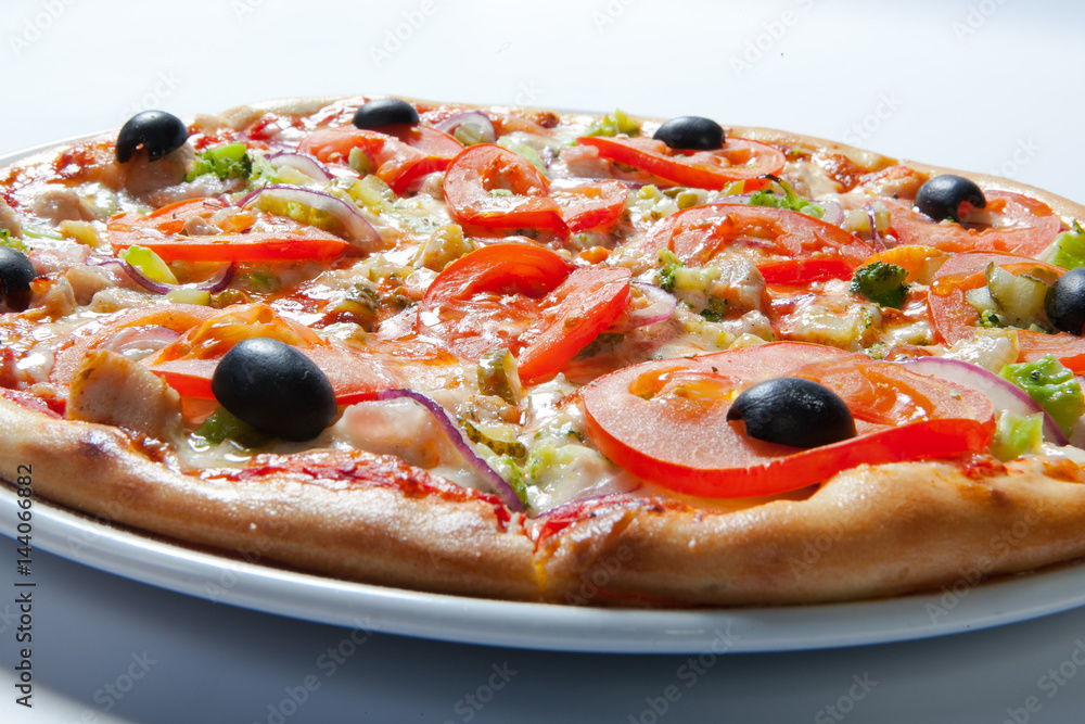 Italian delicious pizza with tomato, broccoli and cheese. Italian delicious pizza with tomato, broccoli and cheese.