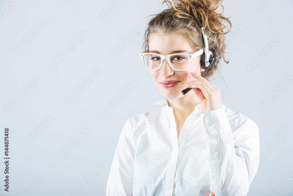 Hard working in corporate telephone service, but smiling beautiful girl. Hard working in corporate telephone service, but smiling beautiful girl.