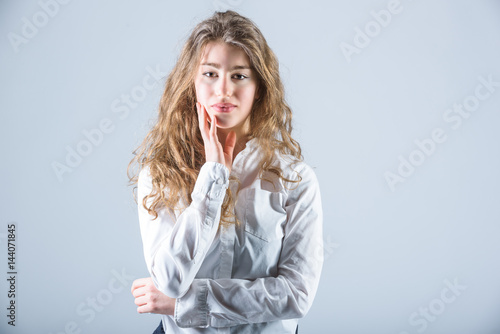 Lovely Anna student beautifully posing on a white background.