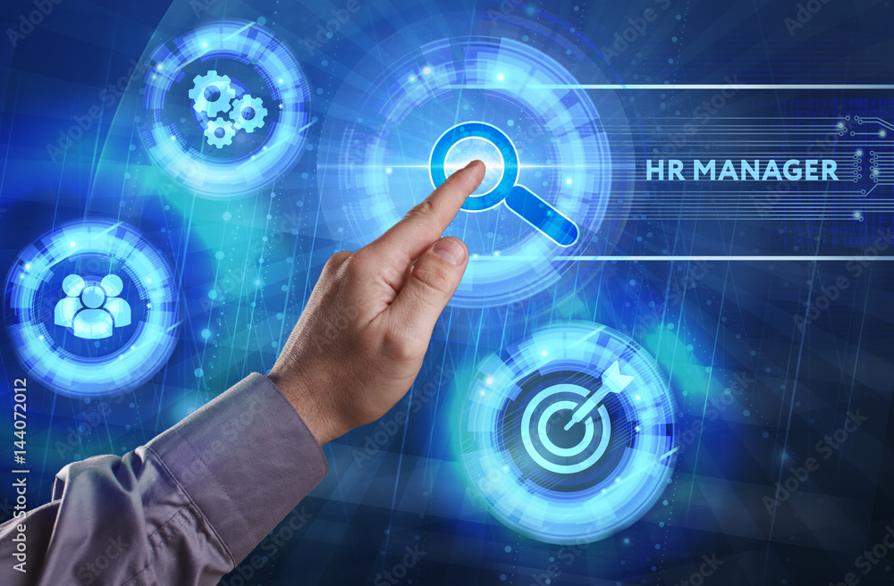 Business, Technology, Internet and network concept. Young businessman working on a virtual screen of the future and sees the inscription: HR manager Business, Technology, Internet and network concept. Young businessman working on a virtual screen of the future and sees the inscription: HR manager